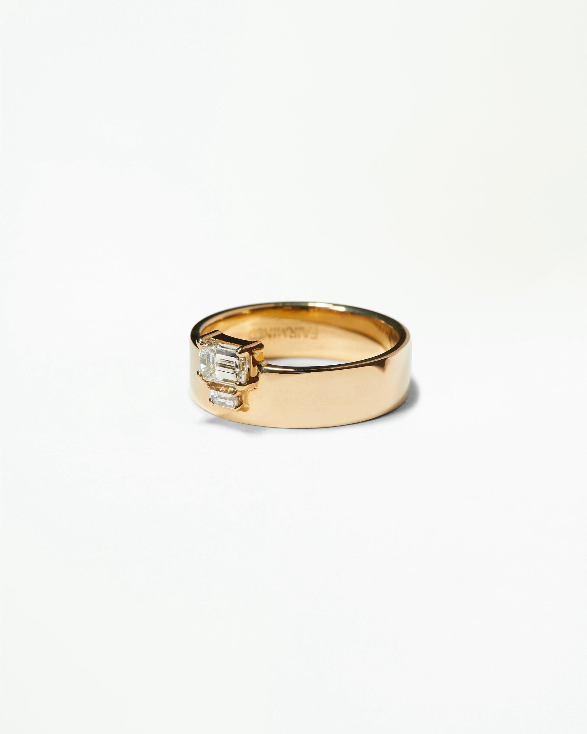 Emerald and Baguette Cut Diamond Bricolage Ring