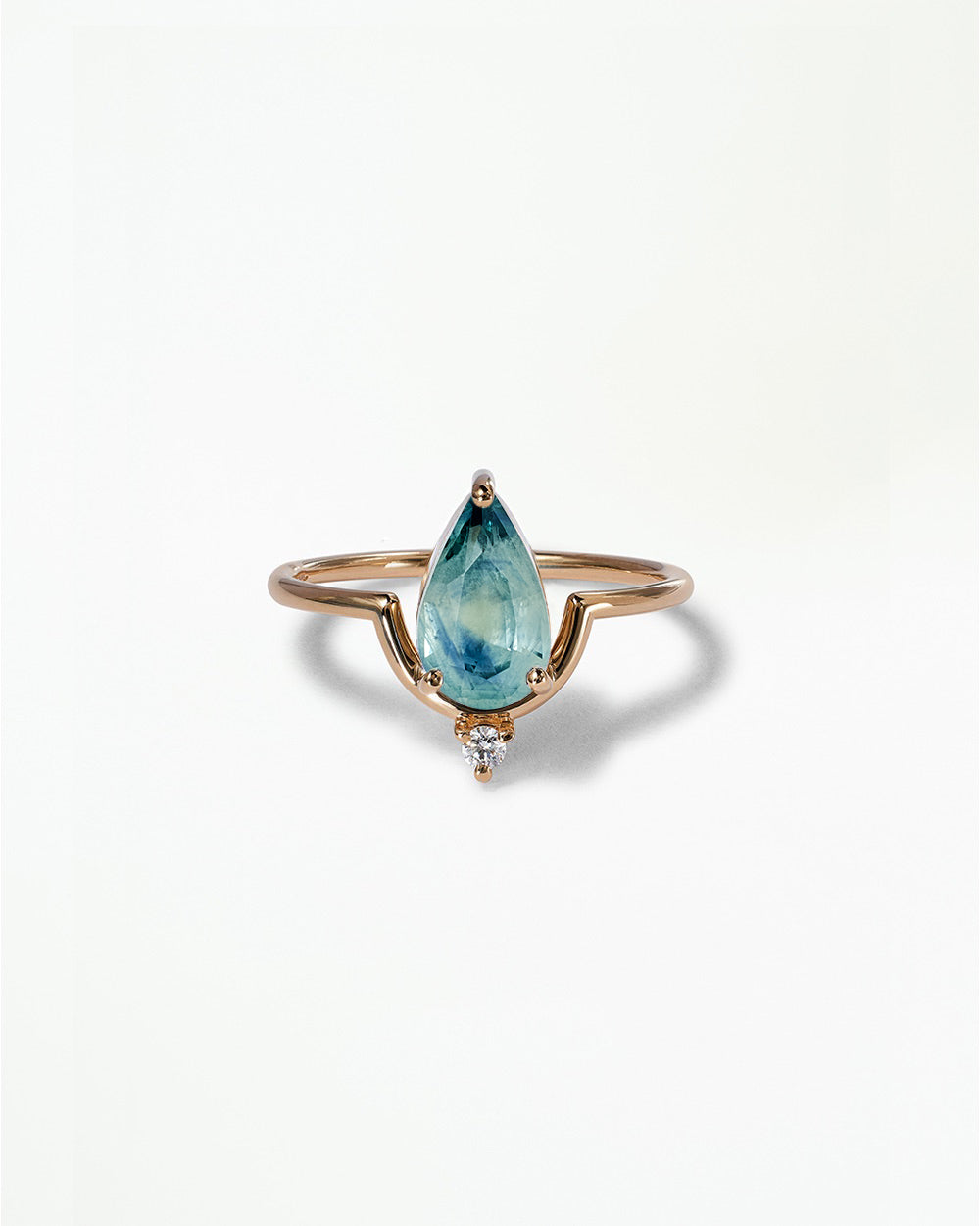 Pear Cut Sapphire Nestled Ring